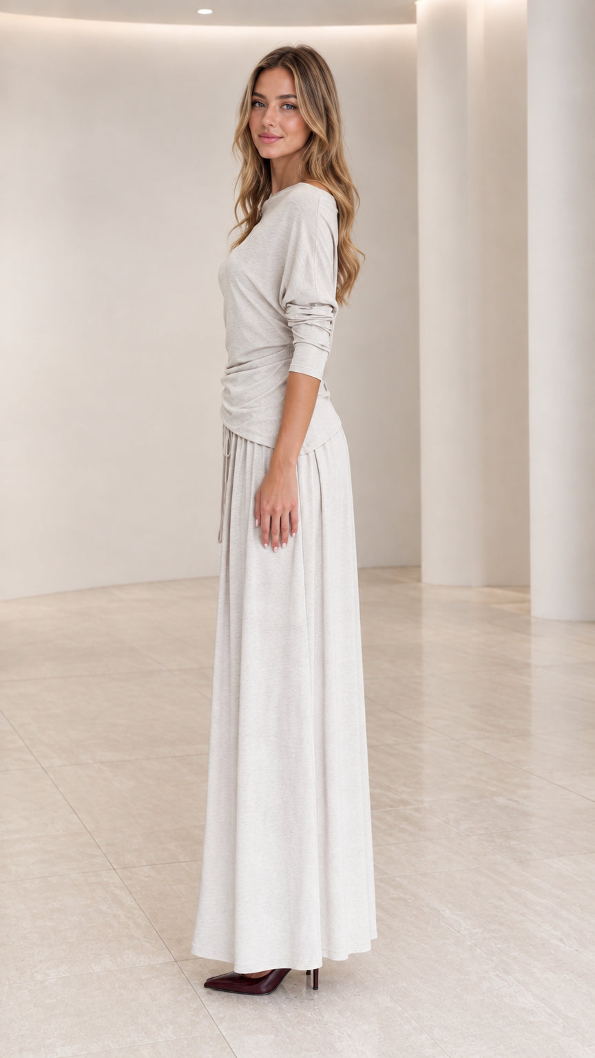 Side full view of woman wearing Heather Grey long sleeve ruched maxi dress