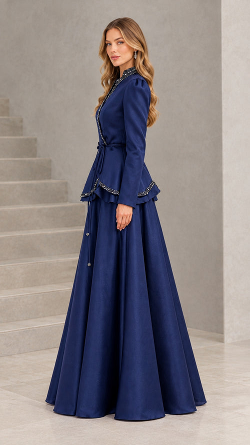 Side profile of model wearing Navy Blue beaded peplum evening gown