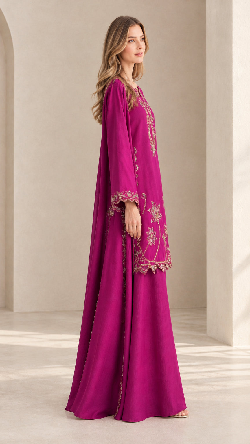 Side angle view of model in magenta two-piece embroidered skirt set
