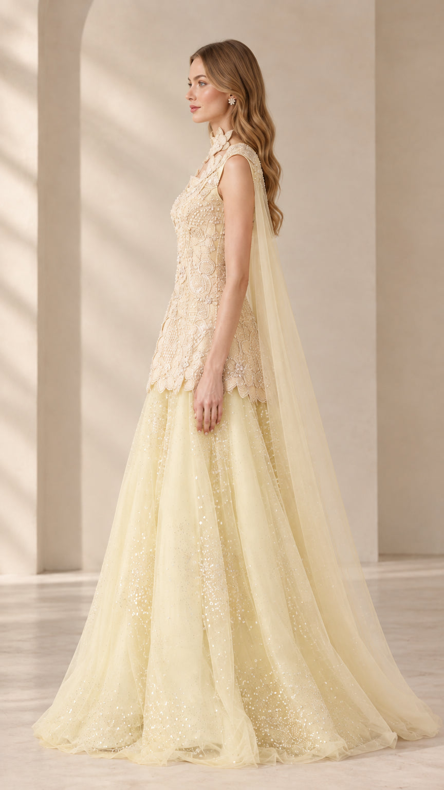 Side profile view of Champagne Yellow beaded formal evening gown with long cape