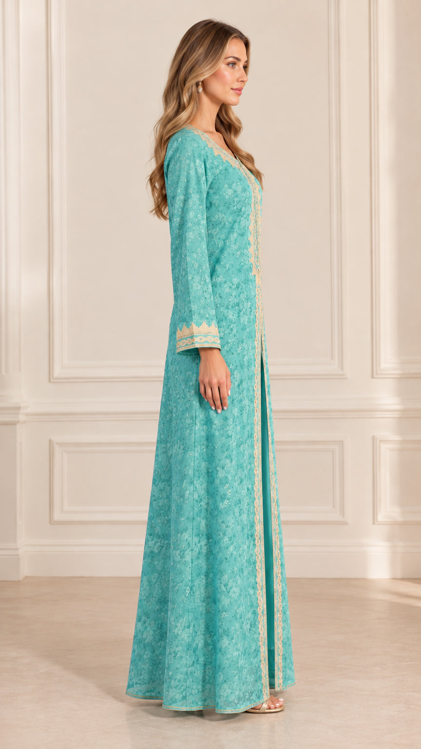 Side angle view of woman modeling long turquoise embroidered kaftan gown