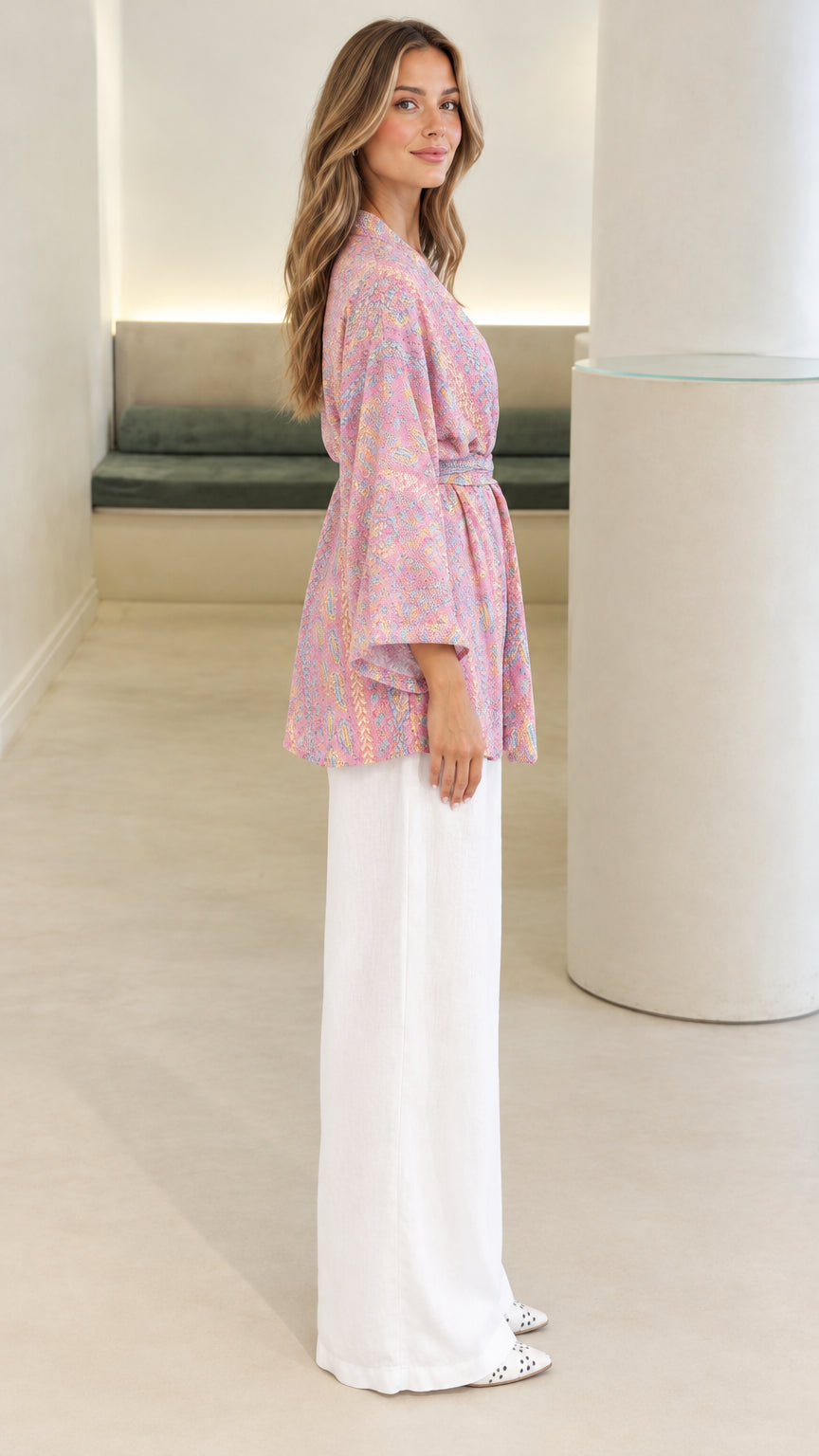 Side view of pink paisley print belted kimono blouse showing sleeve profile