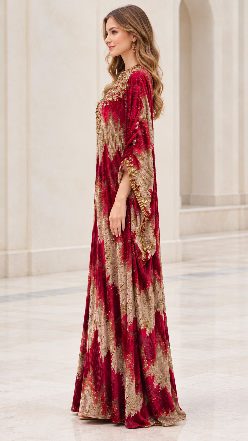 Side profile of model wearing Burgundy flowing velvet kaftan dress