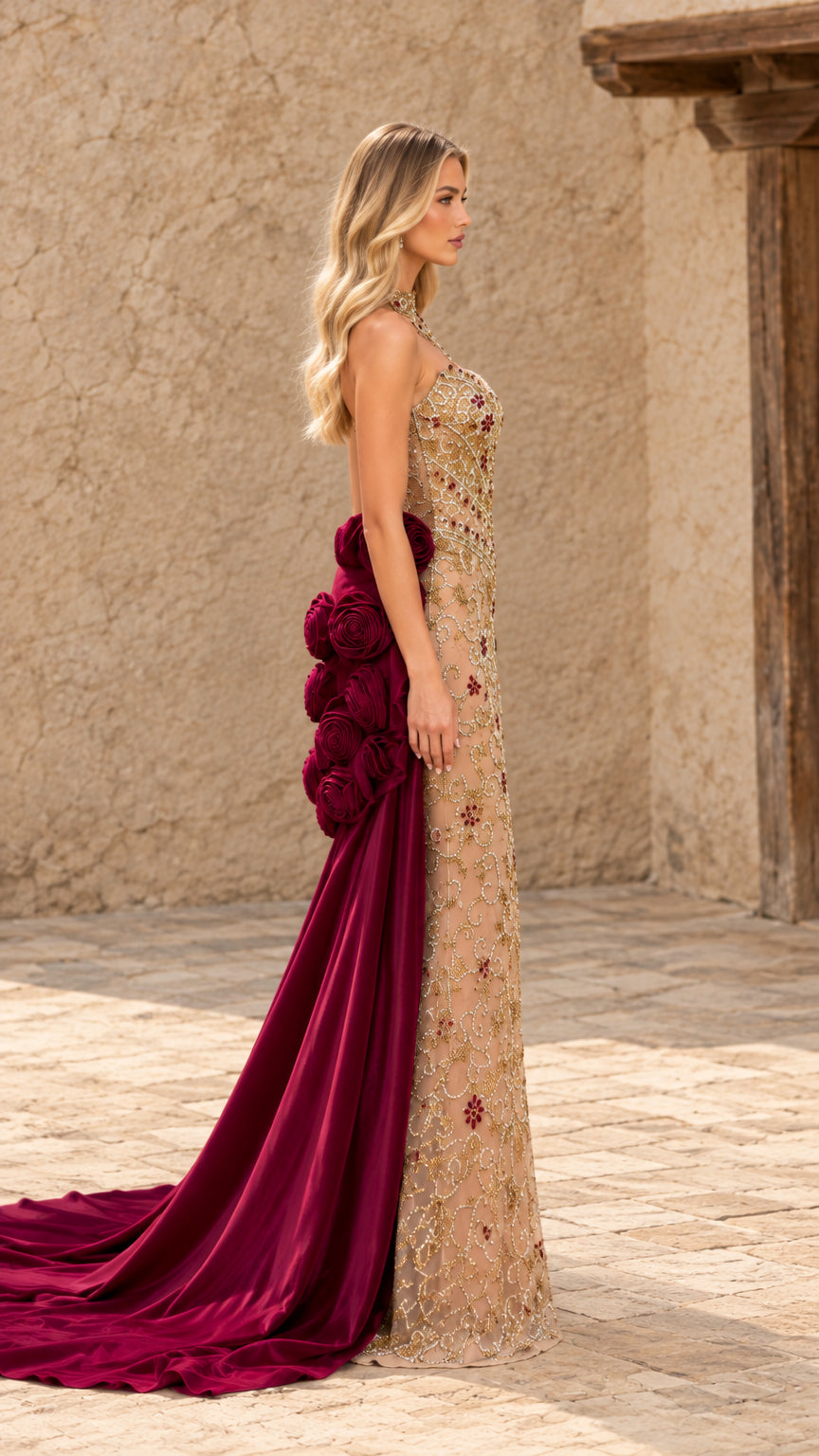 Side profile view of champagne evening gown showcasing long burgundy satin train