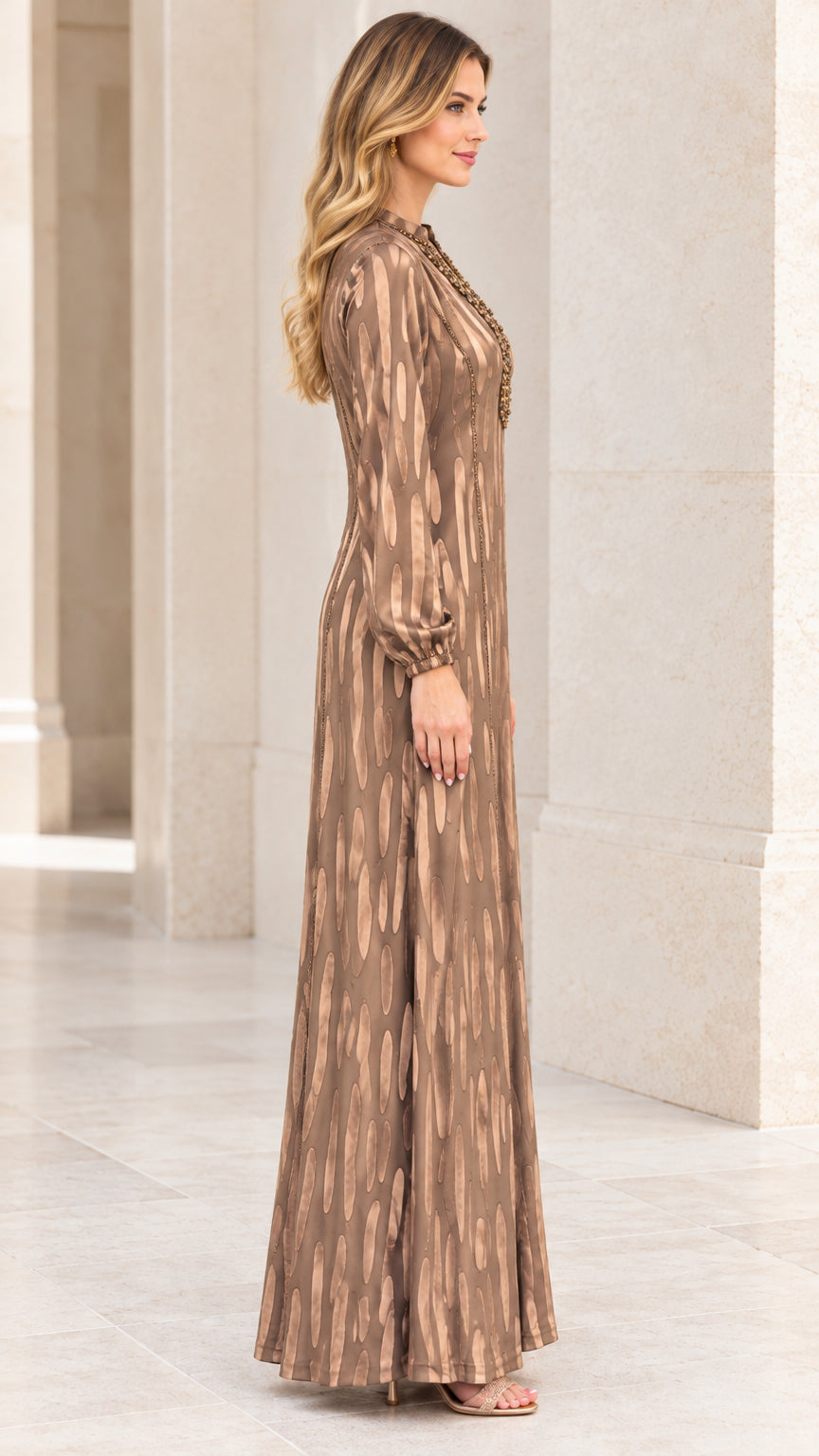 Side profile of Bronze embellished long sleeve floor-length maxi dress