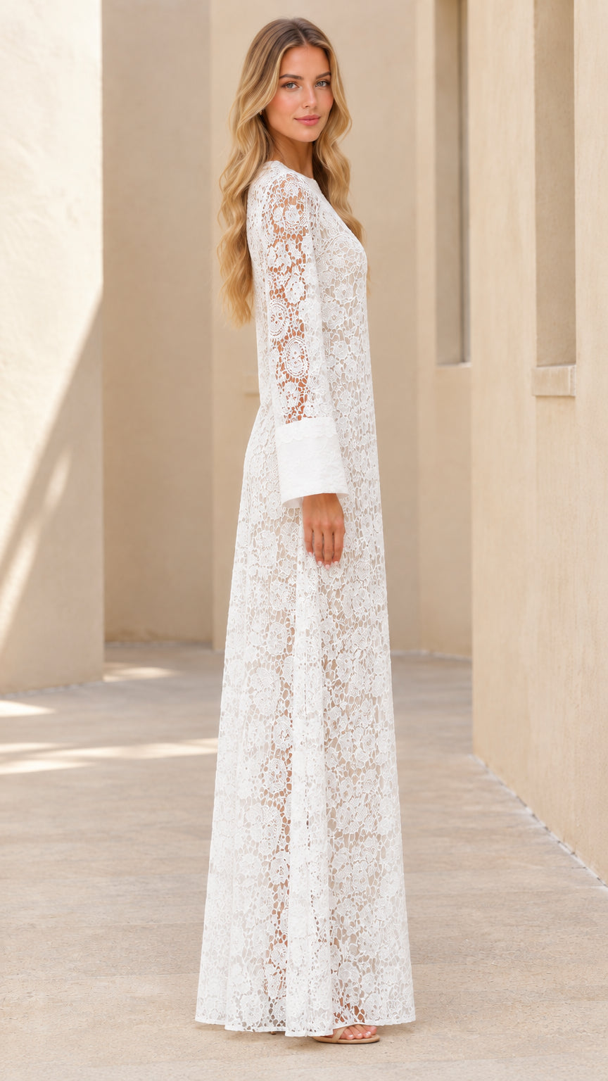 Side profile view of white long sleeve floral lace kaftan maxi dress