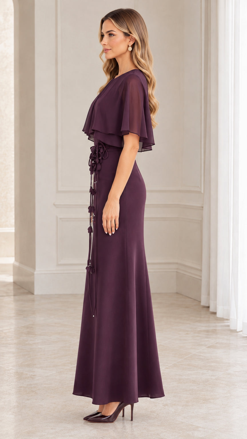 Side profile view of woman modeling the plum capelet evening gown