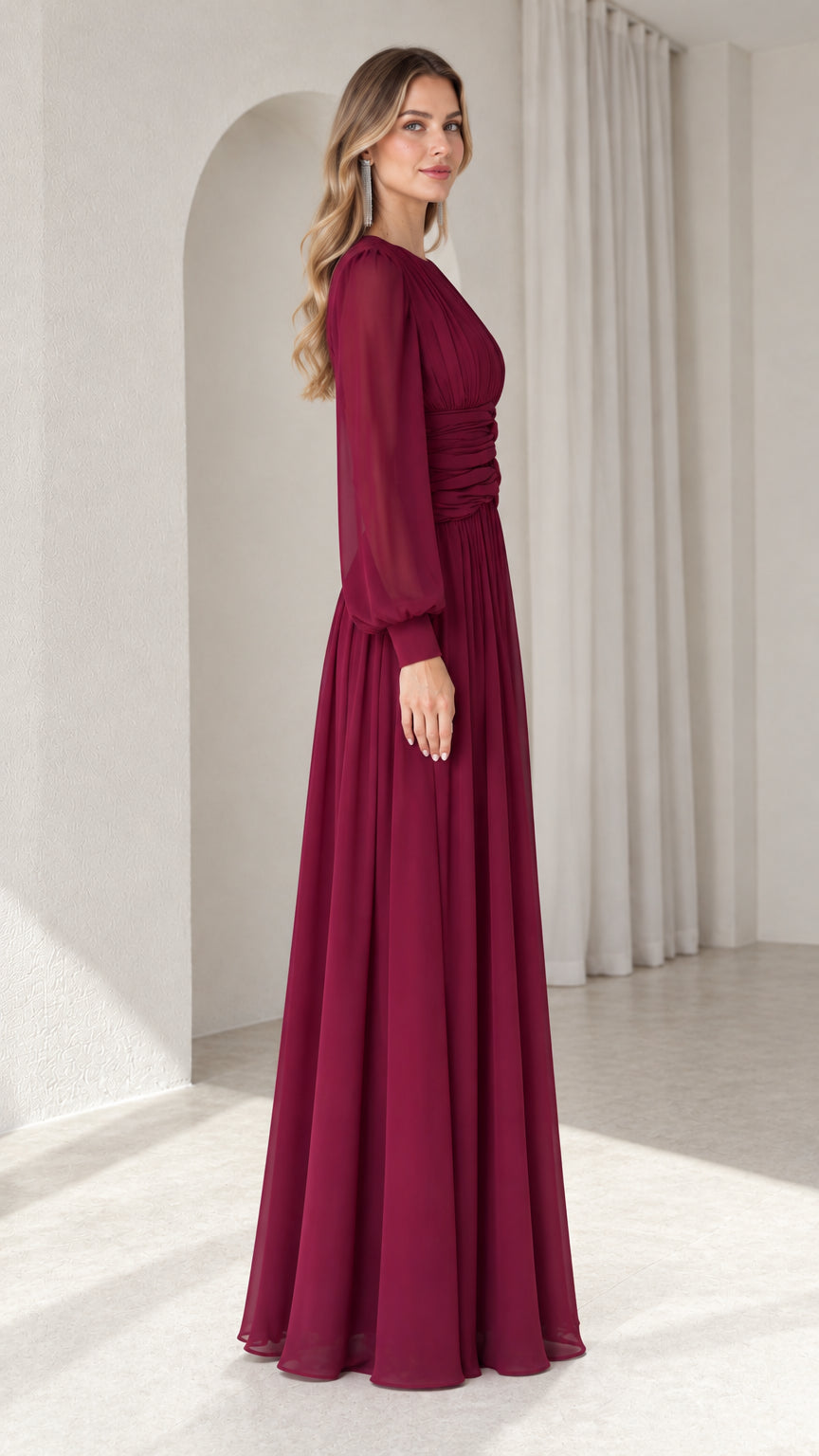 Side profile of burgundy chiffon formal gown showing sleeve volume and floor-length silhouette
