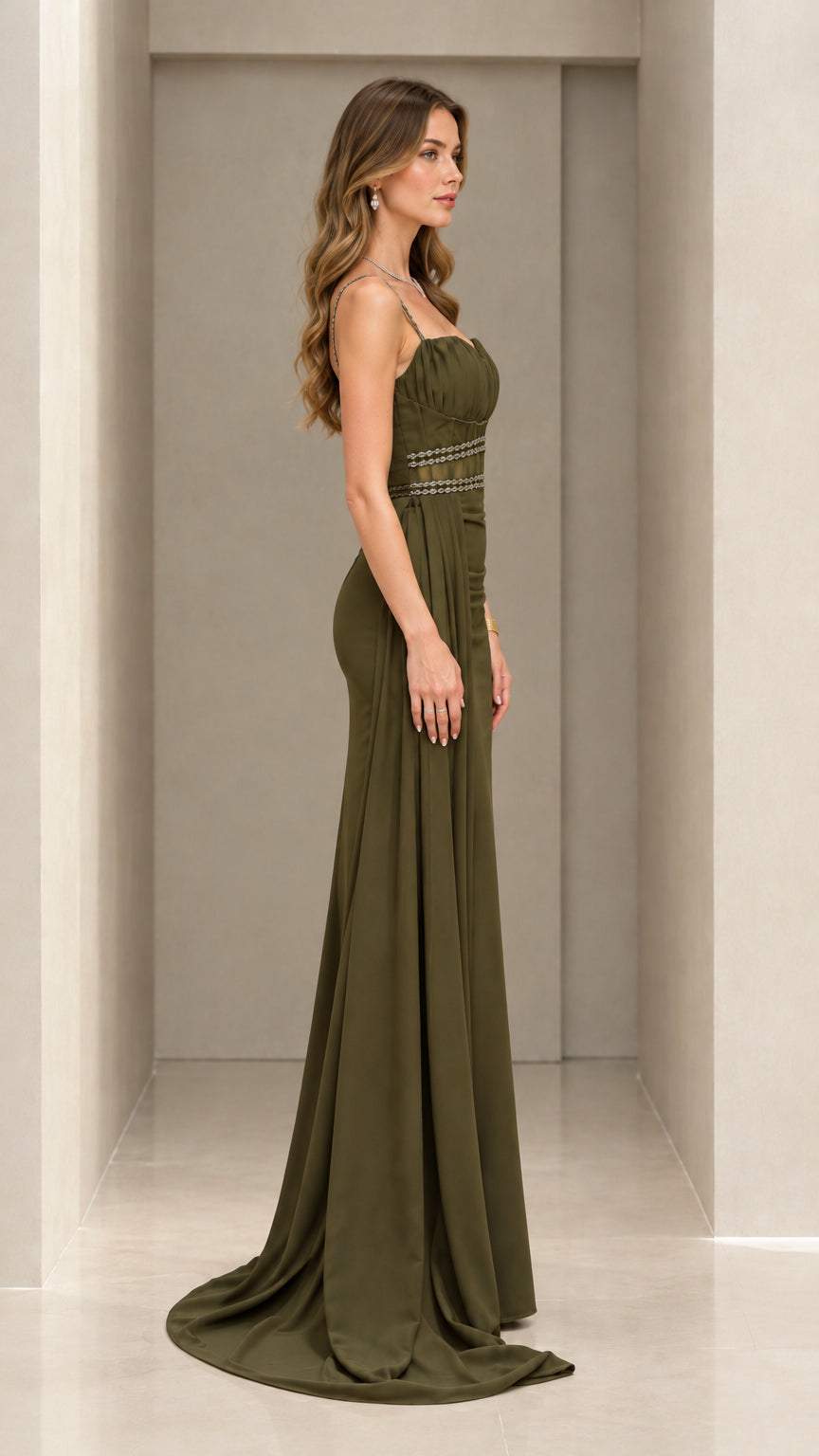 Side profile of olive green floor-length evening dress with sweep train