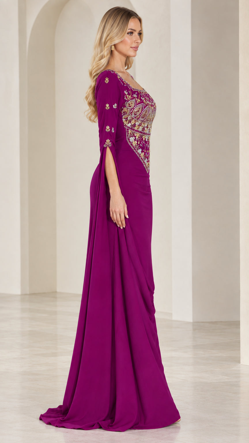 Side profile view of magenta evening gown showing sleeve slit and back drape