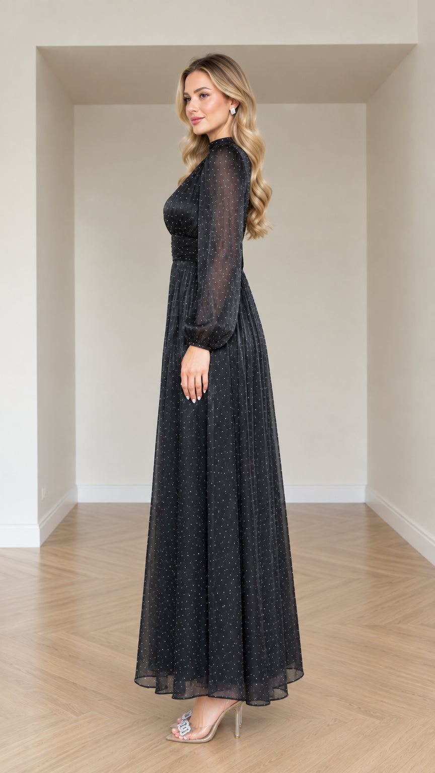 Side profile view of woman modeling Black shimmer long sleeve evening gown