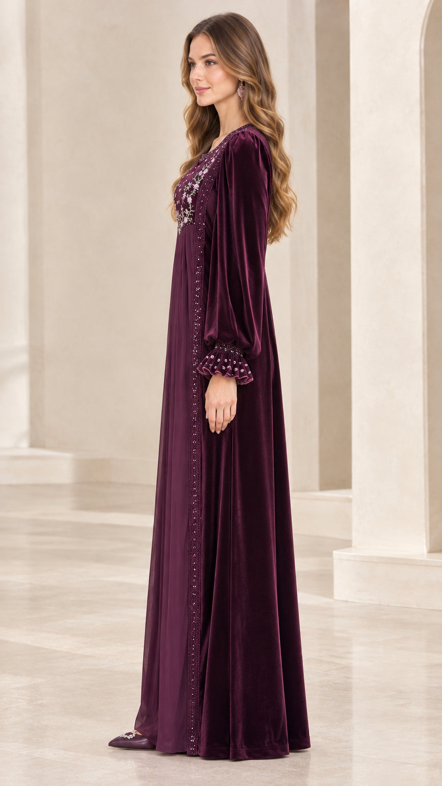 Side profile view of woman modeling Plum long sleeve velvet maxi gown