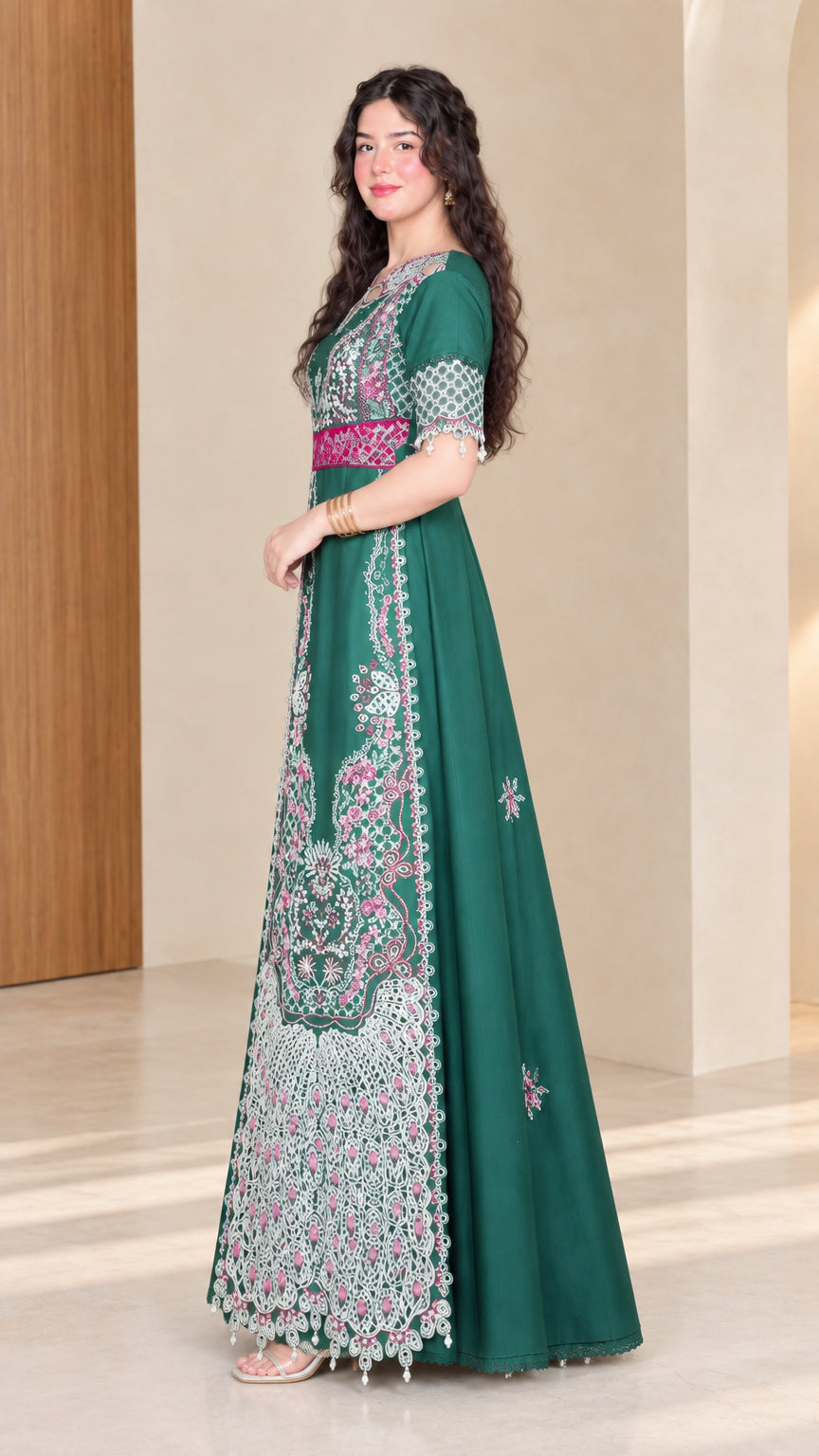 Side full view of woman wearing emerald green embroidered formal maxi dress
