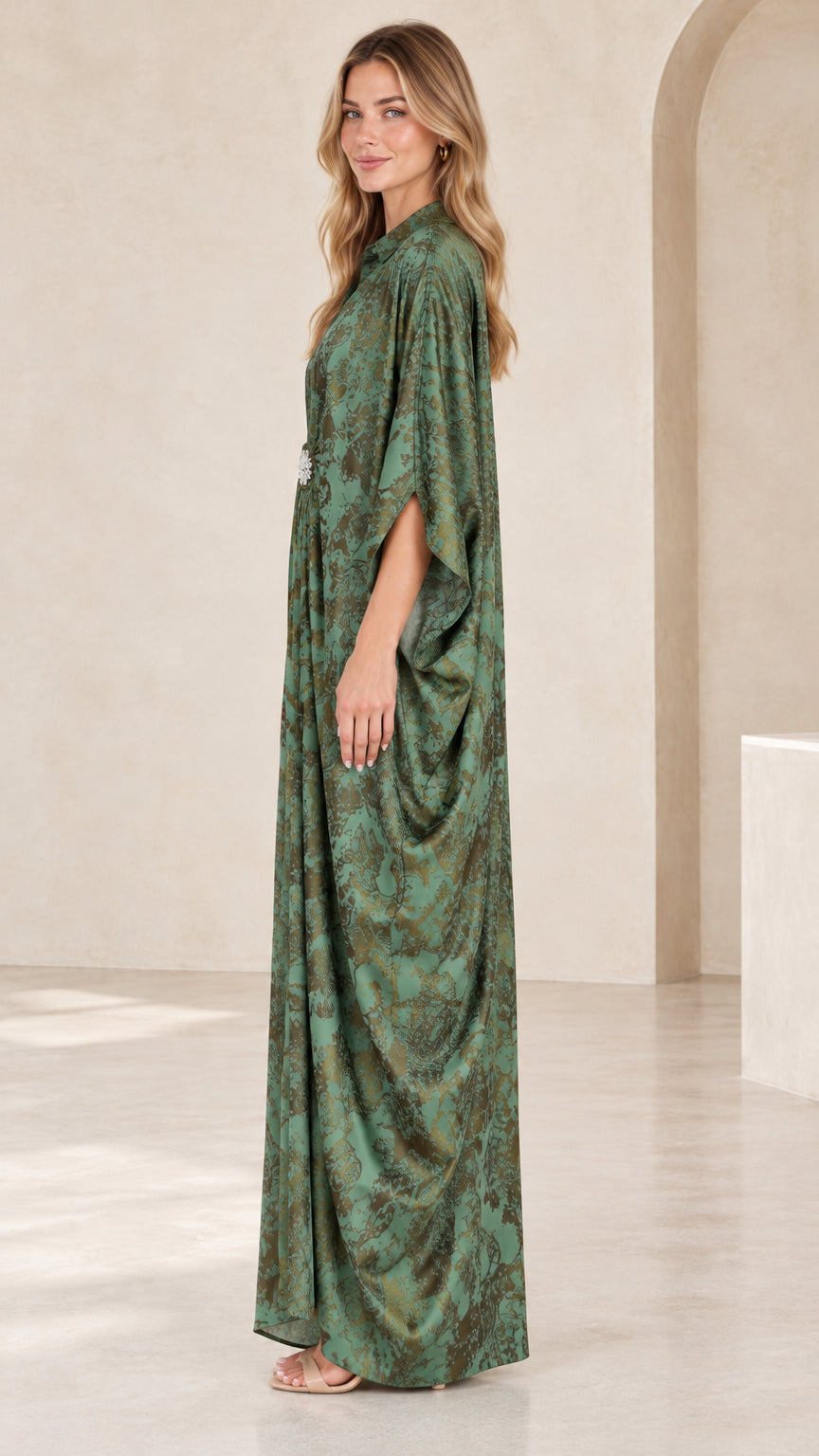 Side profile view of green draped kaftan maxi dress