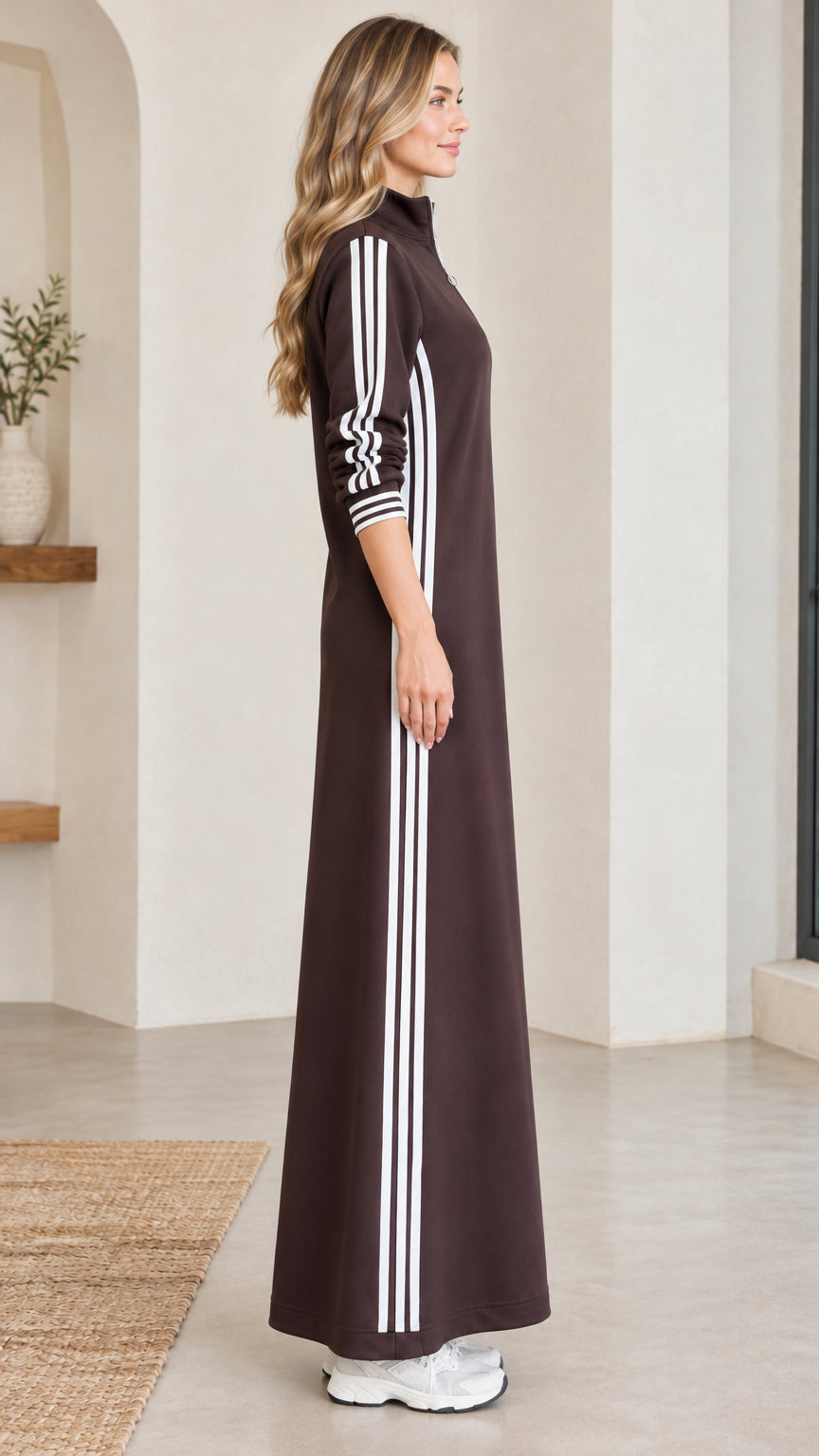 Side profile view of chocolate brown sporty striped maxi dress