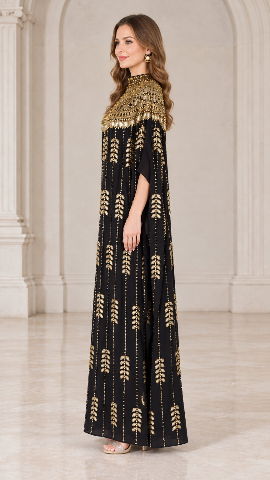 Side angle of black cape sleeve evening kaftan gown with shimmering sequin detailing