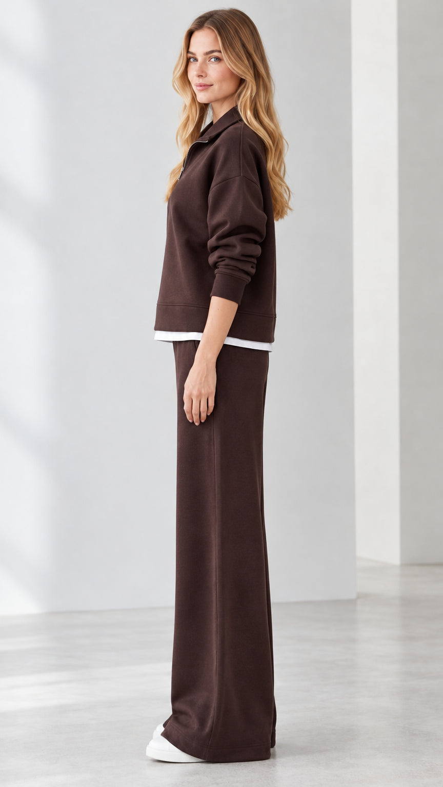Side profile view of model in brown 2-piece wide-leg lounge tracksuit