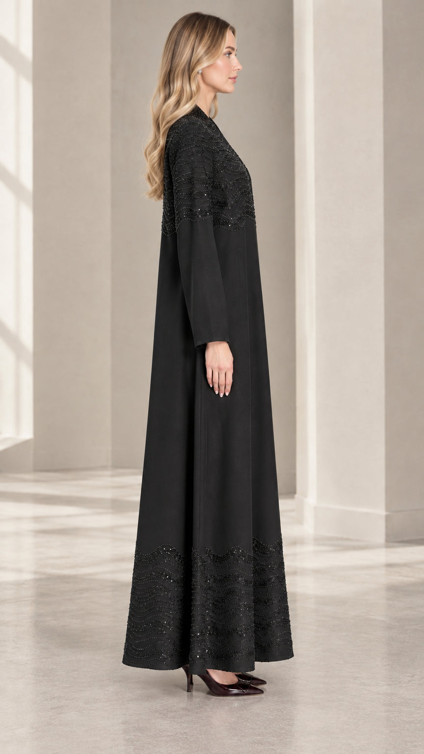 Side full-length view of Black embellished long-sleeve evening maxi gown set