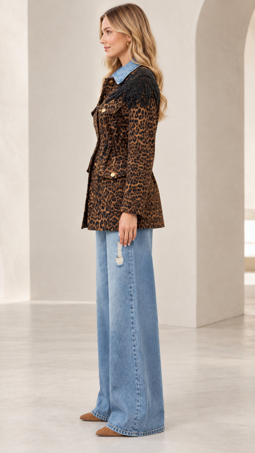 Side profile view of women's leopard print belted utility jacket