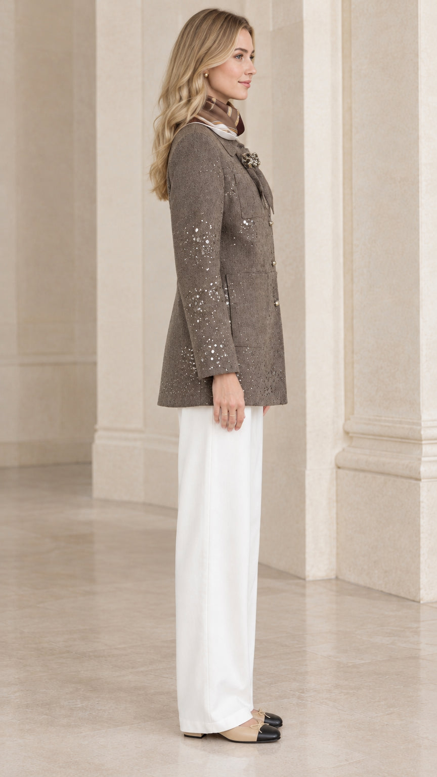 Side profile view of taupe longline embellished tweed jacket