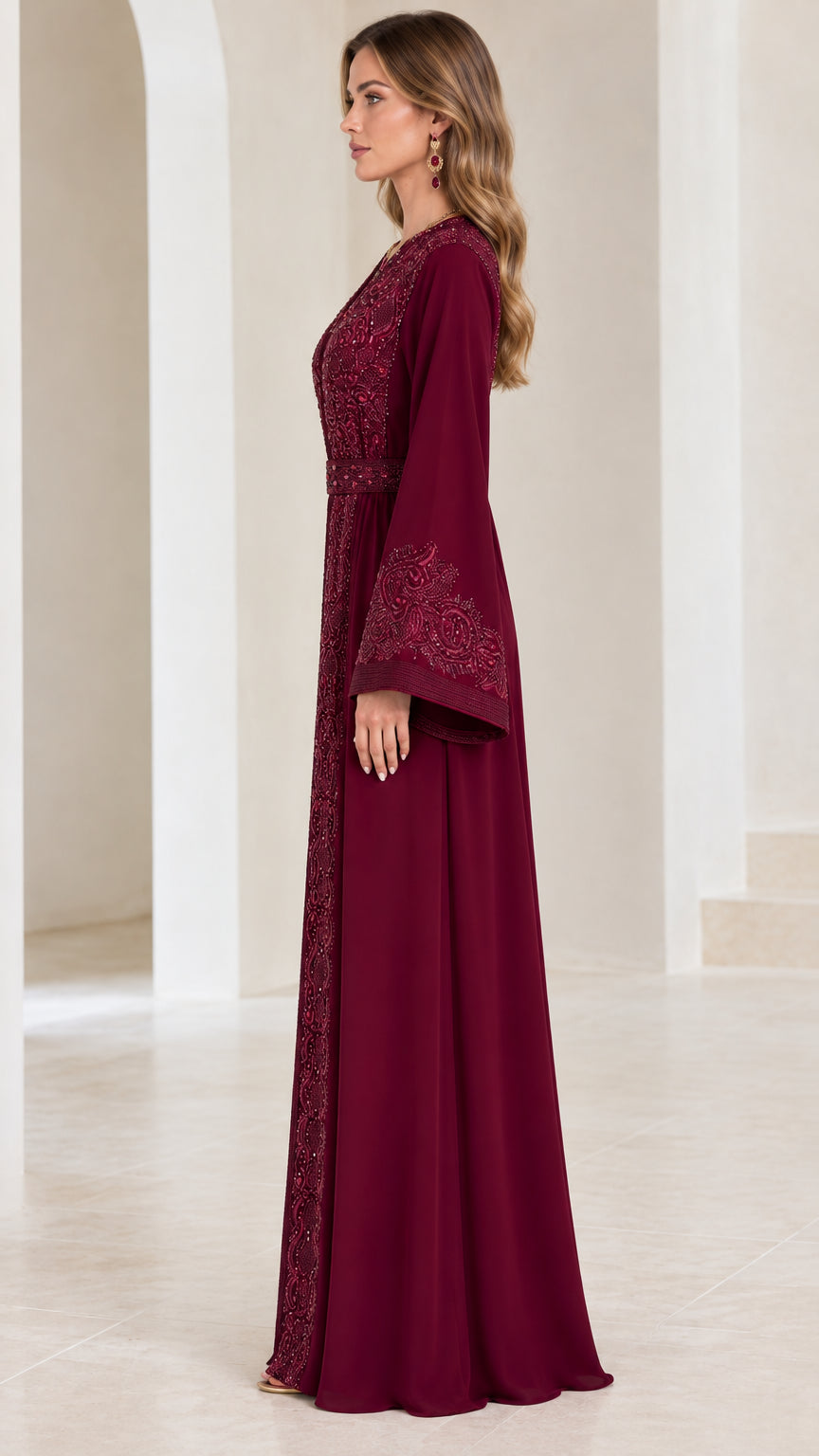 Side profile of burgundy embroidered maxi dress showing sleeve drape and silhouette