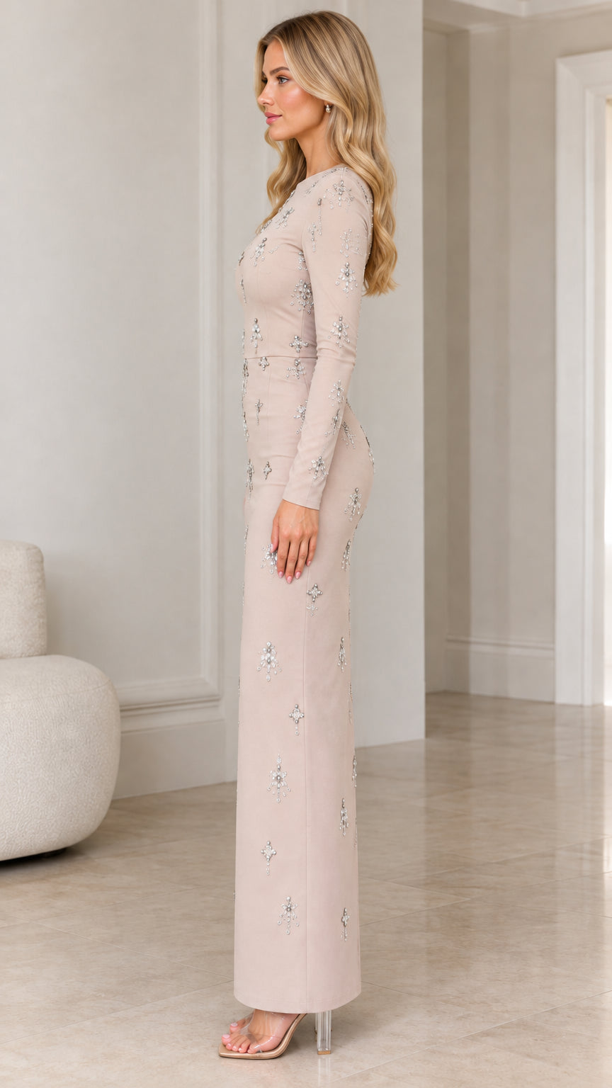 Side profile view of champagne long sleeve beaded evening gown