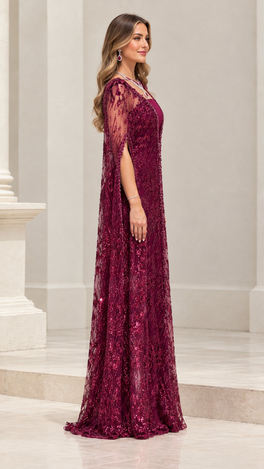 Side profile of burgundy sequin cape maxi dress