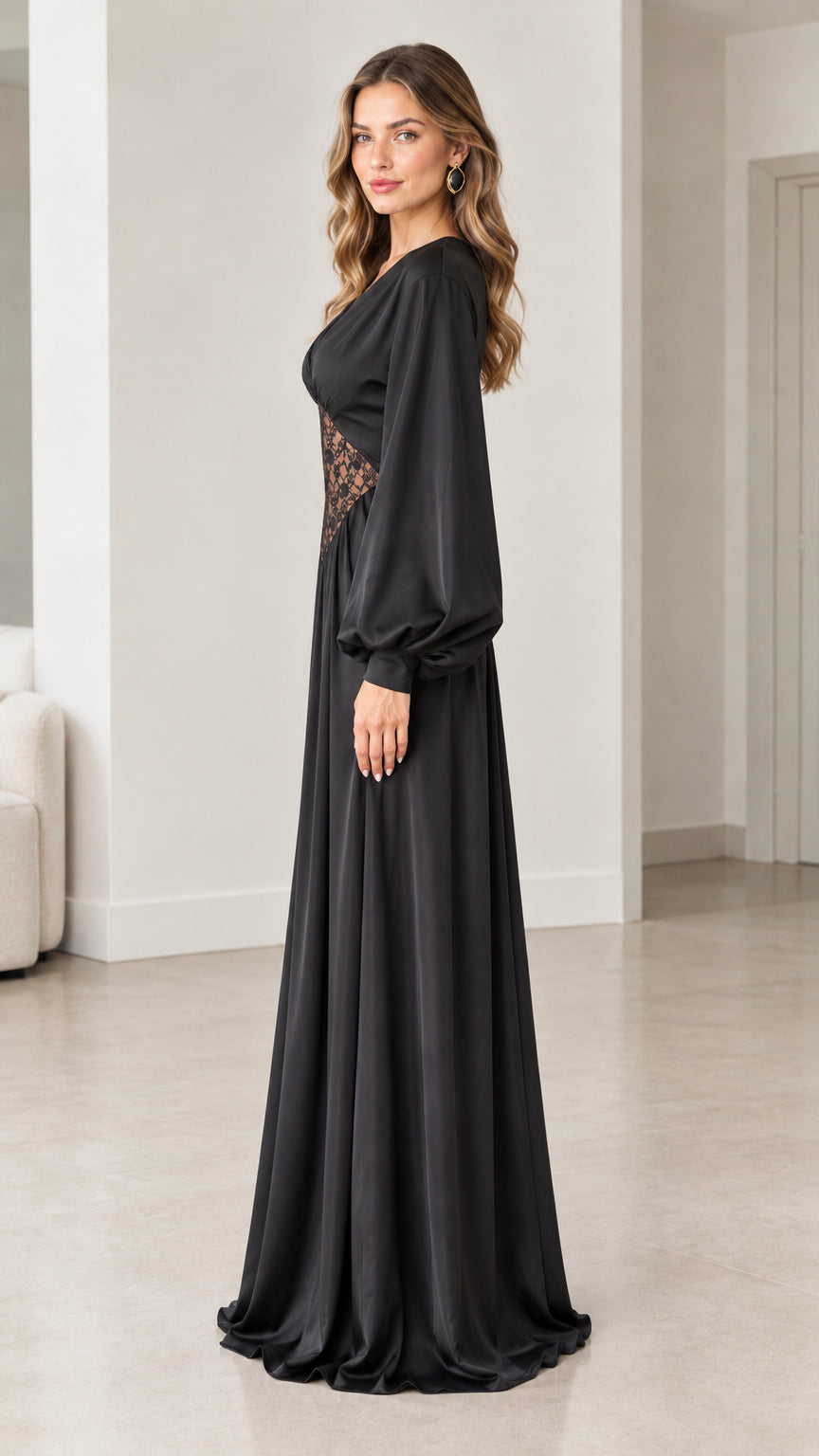 Side profile view of woman wearing elegant black satin maxi gown