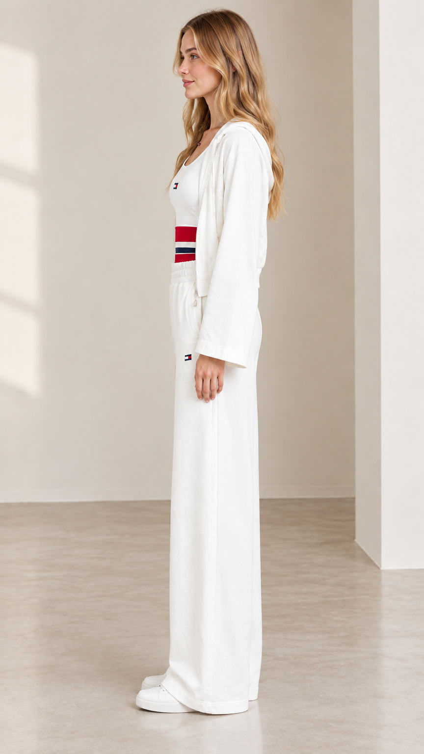 Side profile of women's white 3-piece loungewear set showing loose leg silhouette