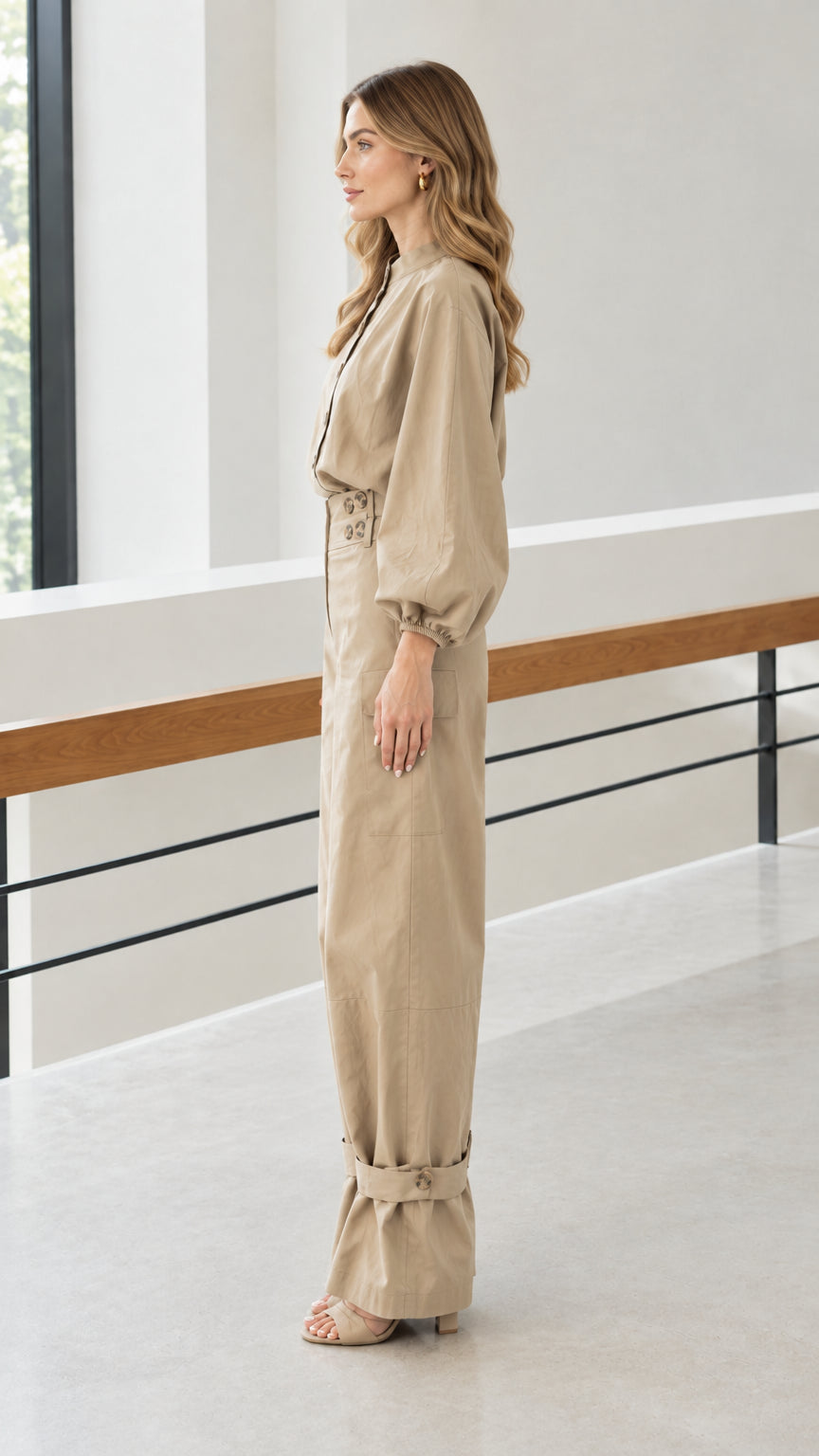 Side profile of woman in khaki lantern sleeve top and matching cargo trousers