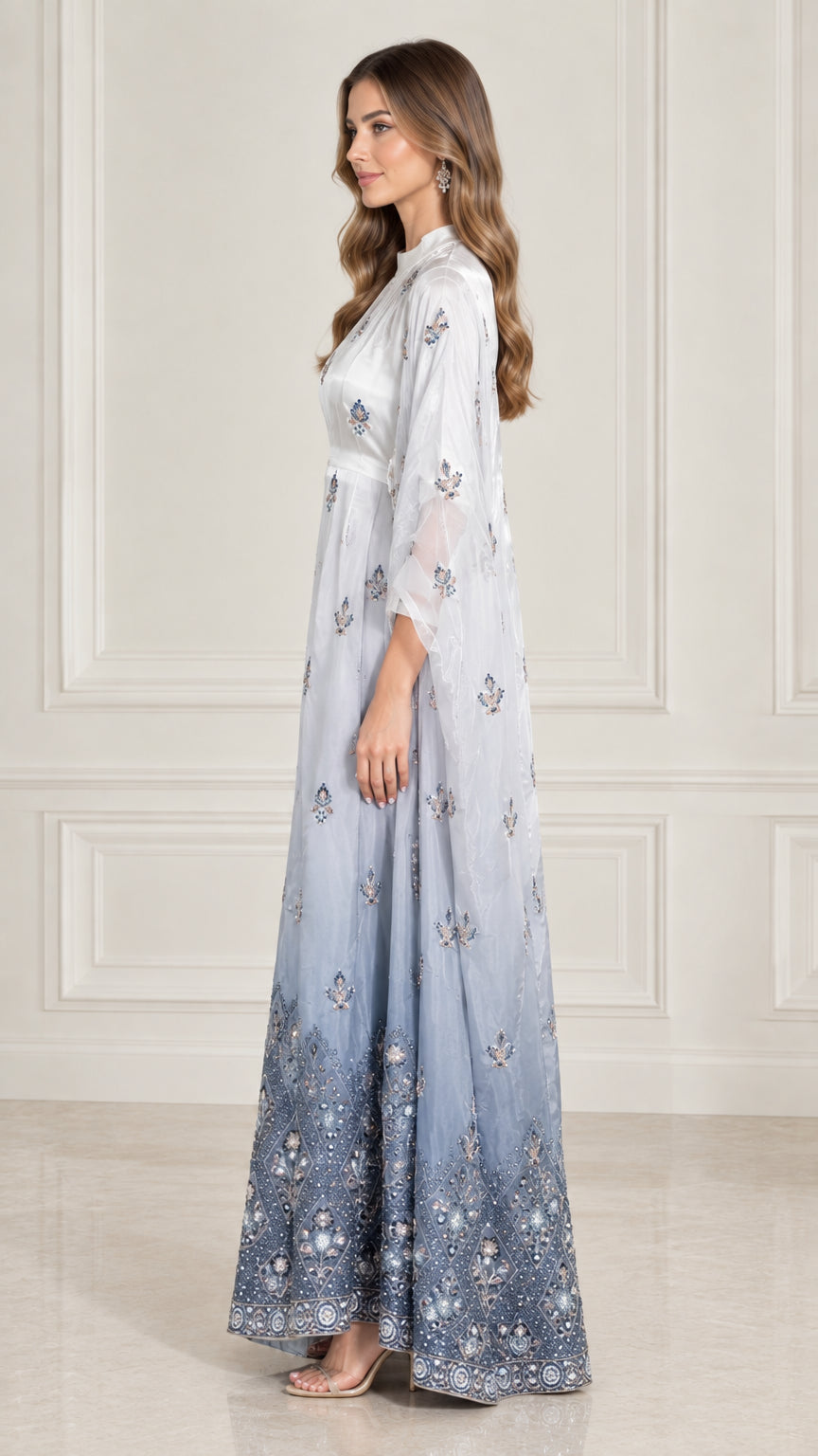 Side profile view of Ice Blue embroidered cape maxi evening gown