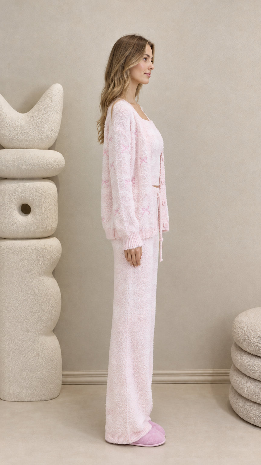 Side view of model wearing pink fuzzy knit 3-piece loungewear set