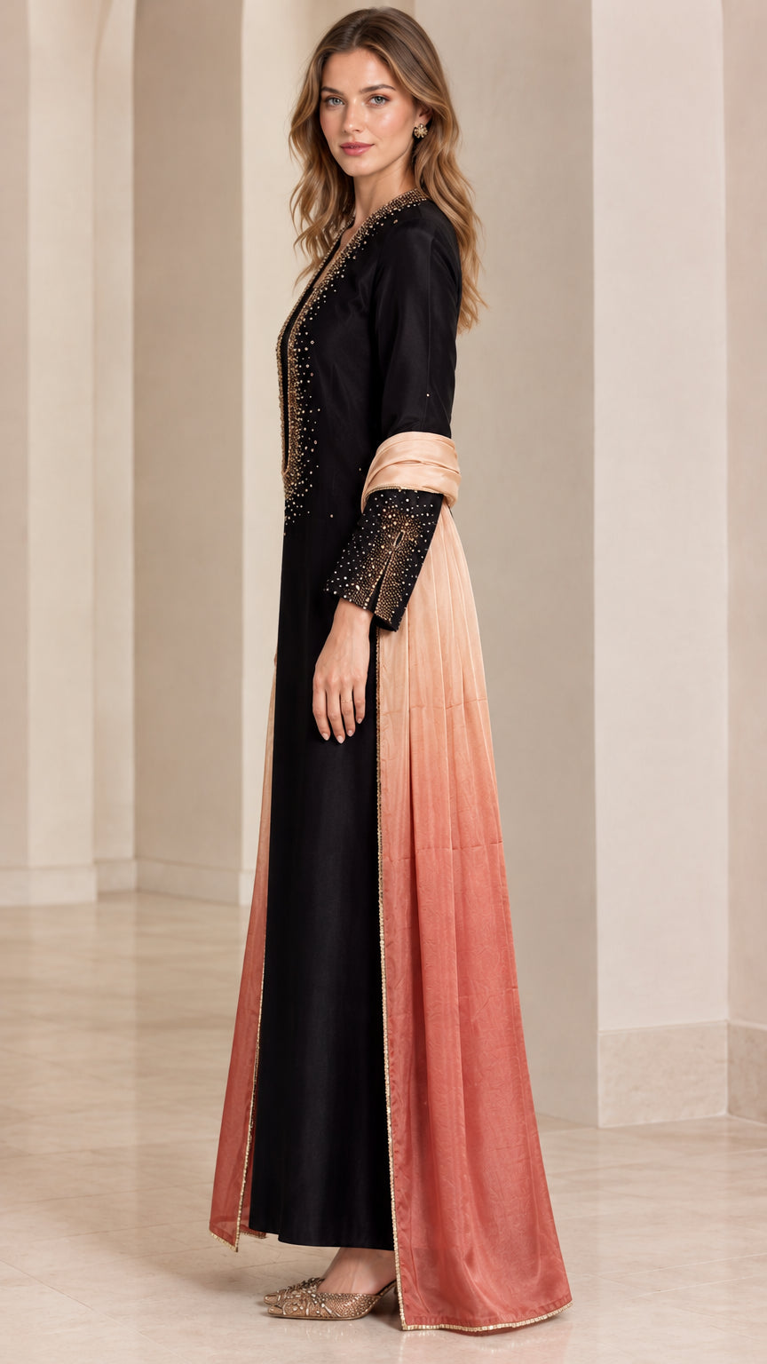 Side profile of woman wearing black long sleeve beaded maxi dress