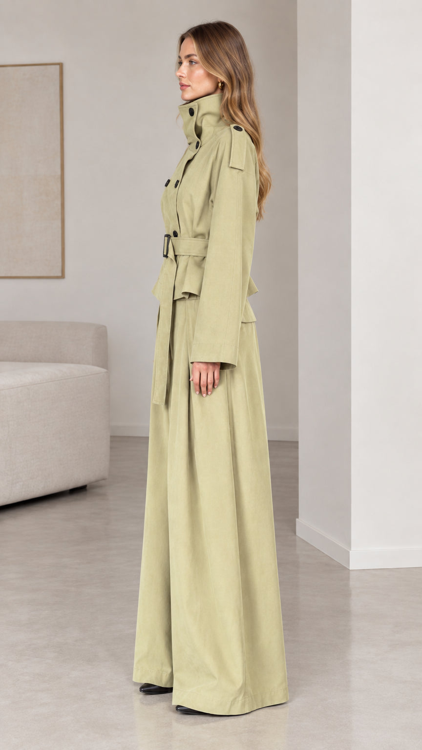 Side profile of woman in sage green high-neck belted two-piece pant set