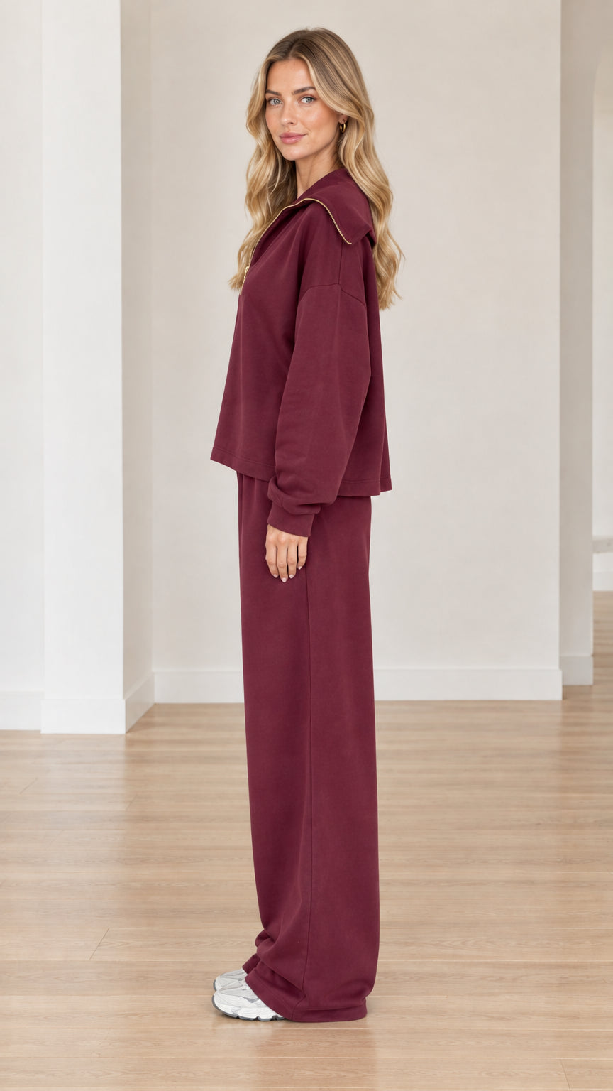 Side profile view of model in burgundy two-piece fleece loungewear set