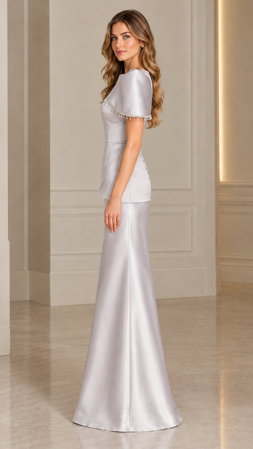 Side profile of silver satin formal maxi dress showing structured silhouette