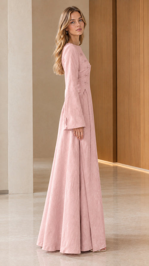 Side profile view of Blush Pink textured long sleeve evening maxi dress