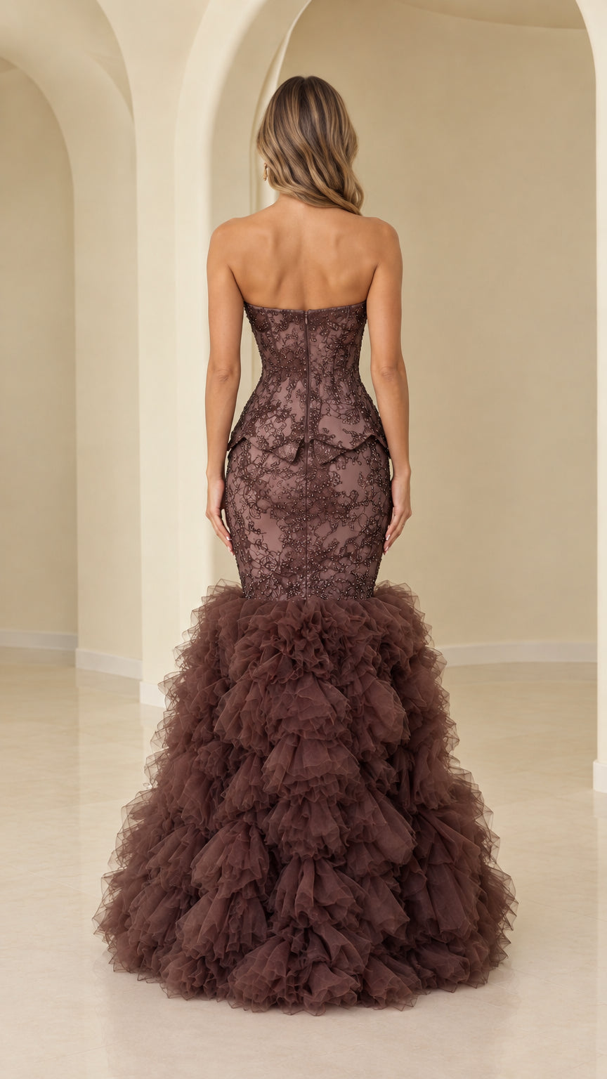 Back view of model wearing chocolate brown strapless corset mermaid gown