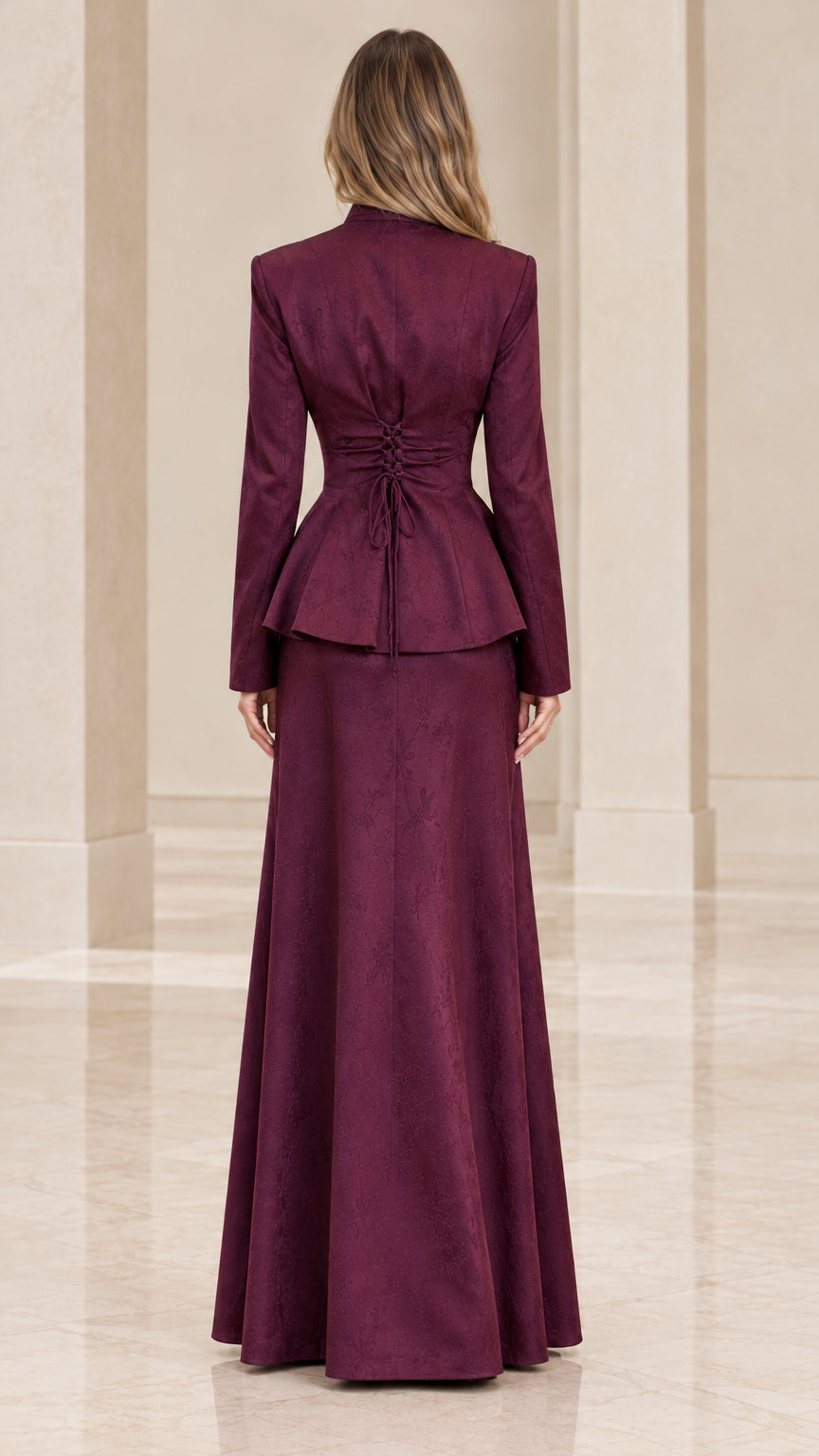 Back view of burgundy formal peplum suit showing adjustable cinch ties