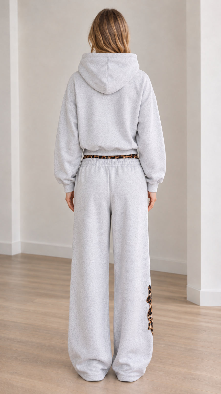Rear view of women's Heather Grey relaxed hoodie and matching sweatpants