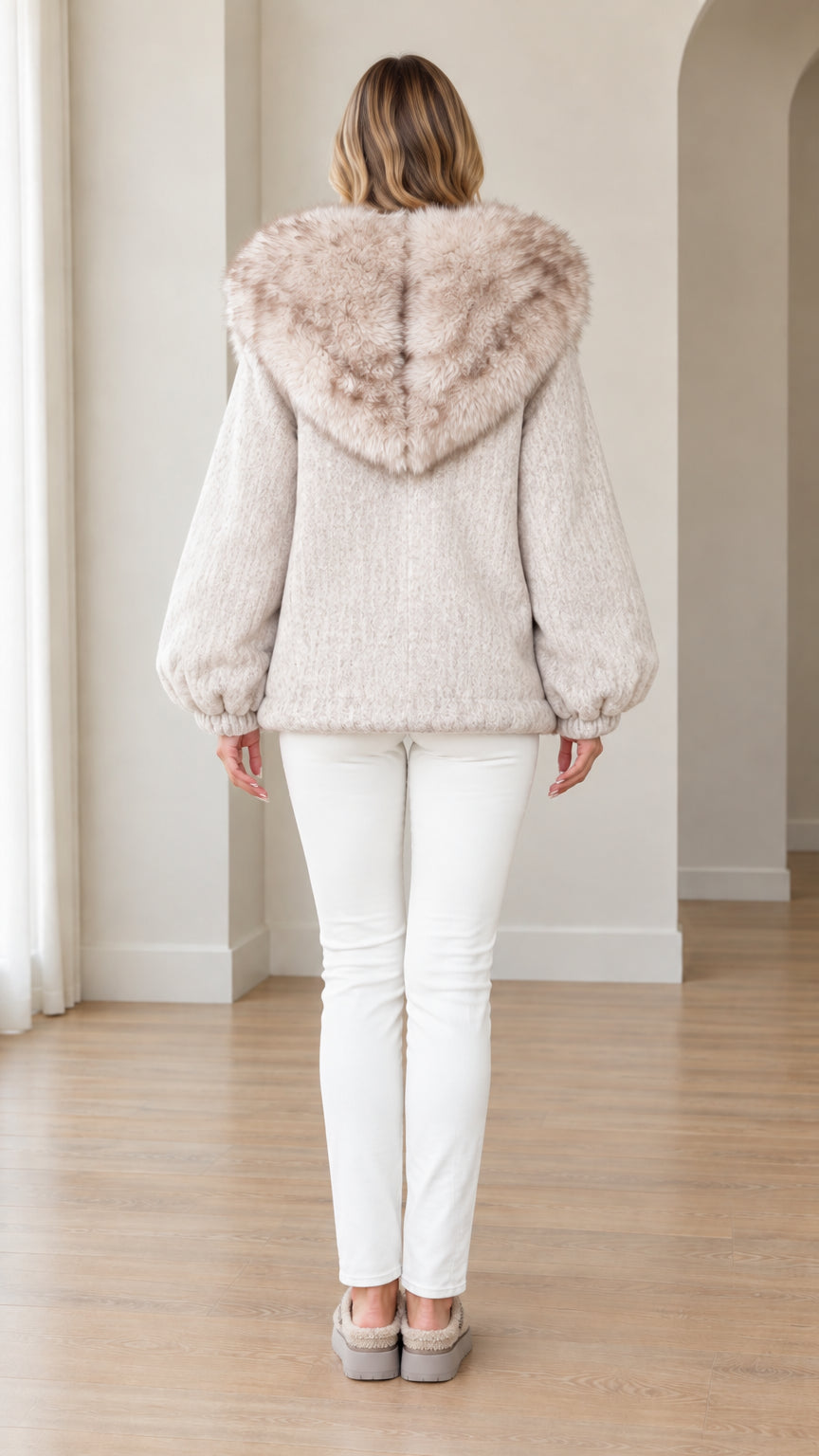 Back view of oatmeal hooded jacket showing wide faux fur hood detail