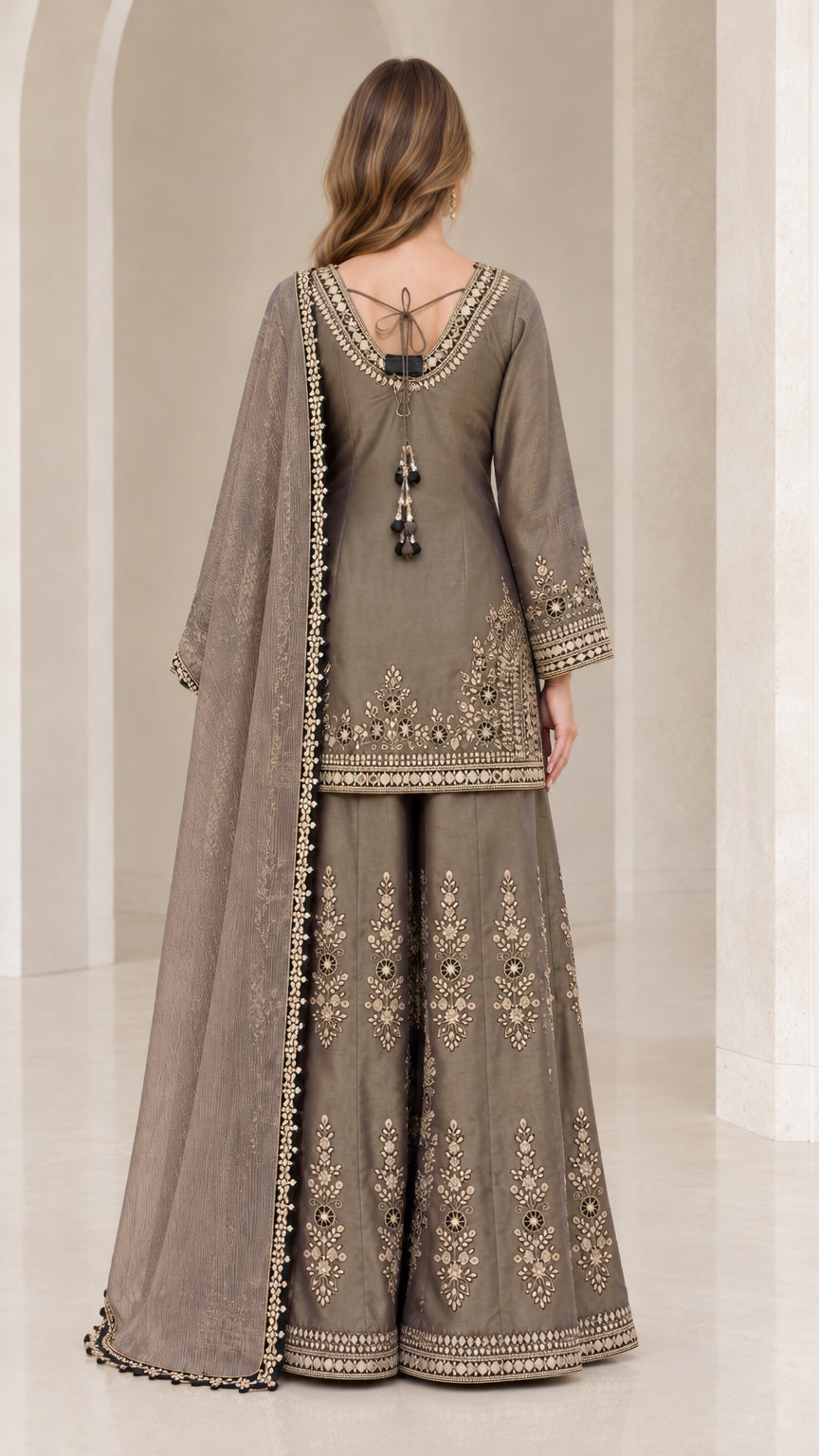 Back view of taupe grey ethnic kurti sharara set showing dori tassel detail