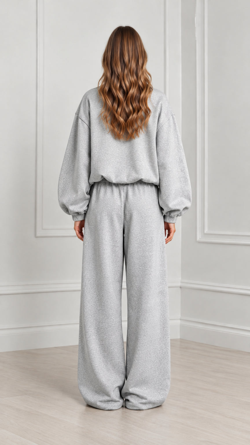 Back view of women's heather grey zip-up sweatshirt and wide leg loungewear set
