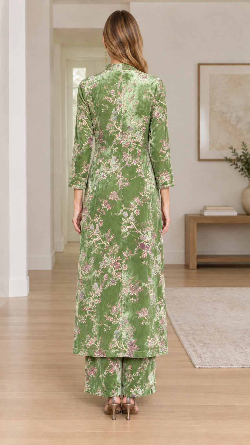 Back view of model wearing Sage Green floral velvet long tunic and pants