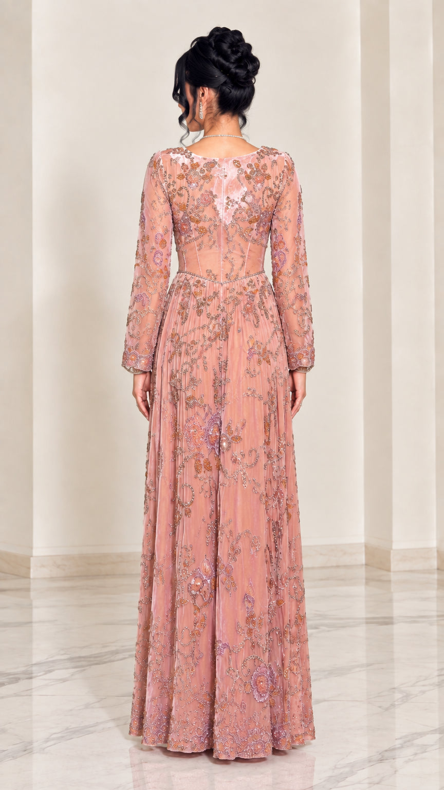Back view of dusty pink evening gown showing sheer illusion back and embellished skirt