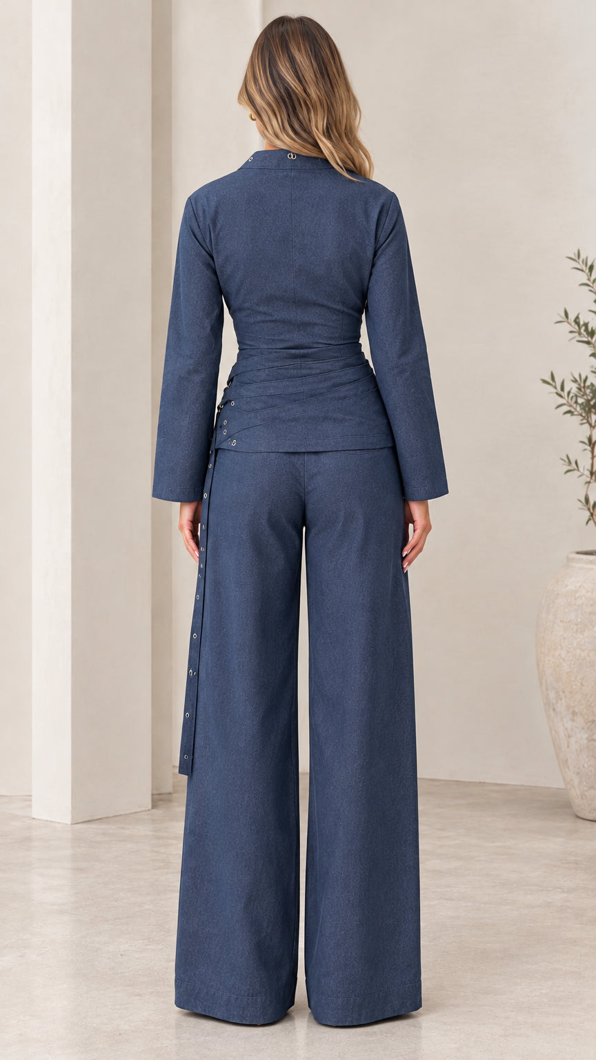 Model wearing Navy Blue open bolero and high-waisted wide leg pants - back view