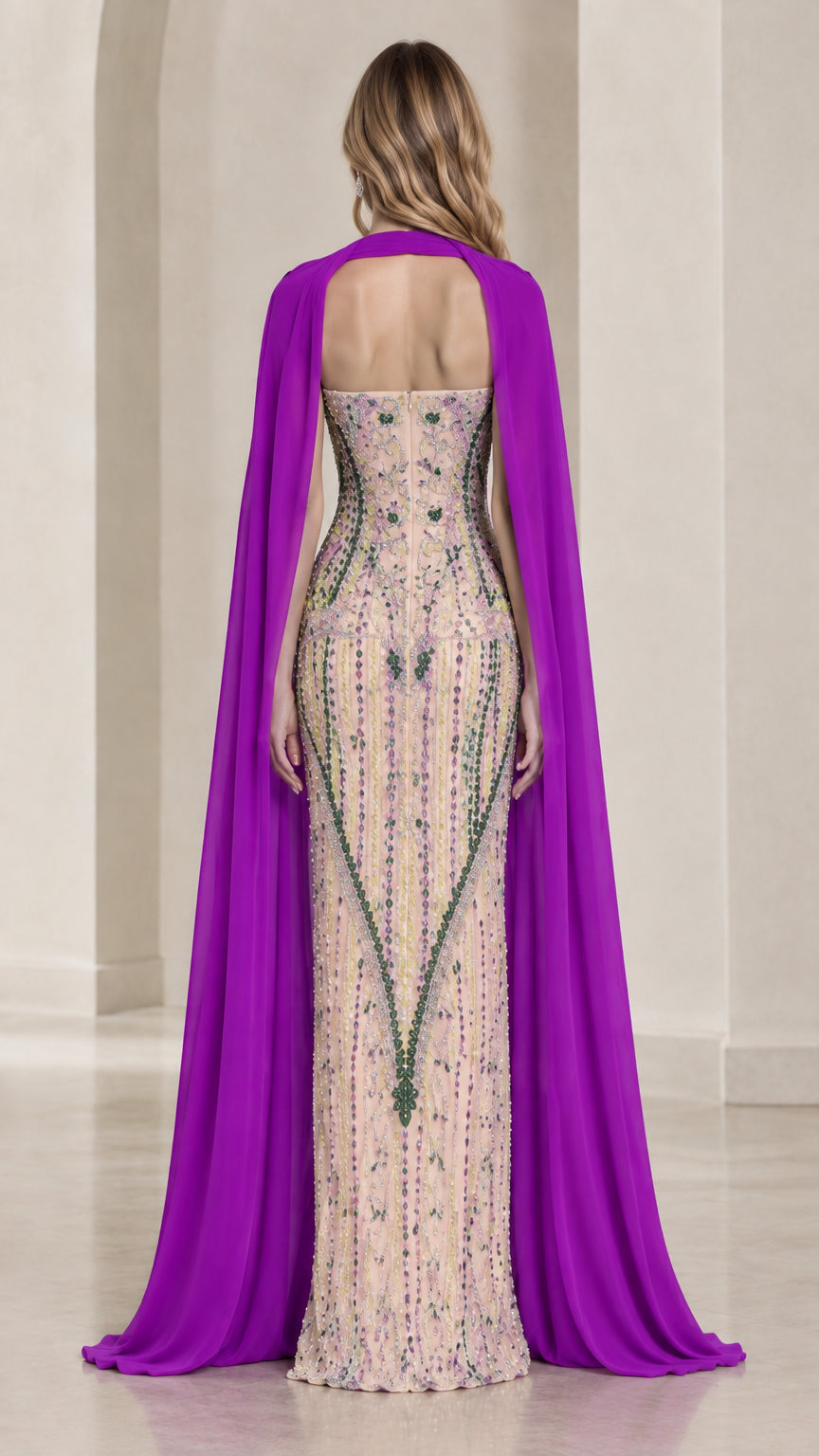 Rear view displaying flowing purple chiffon cape over beaded strapless floor-length gown