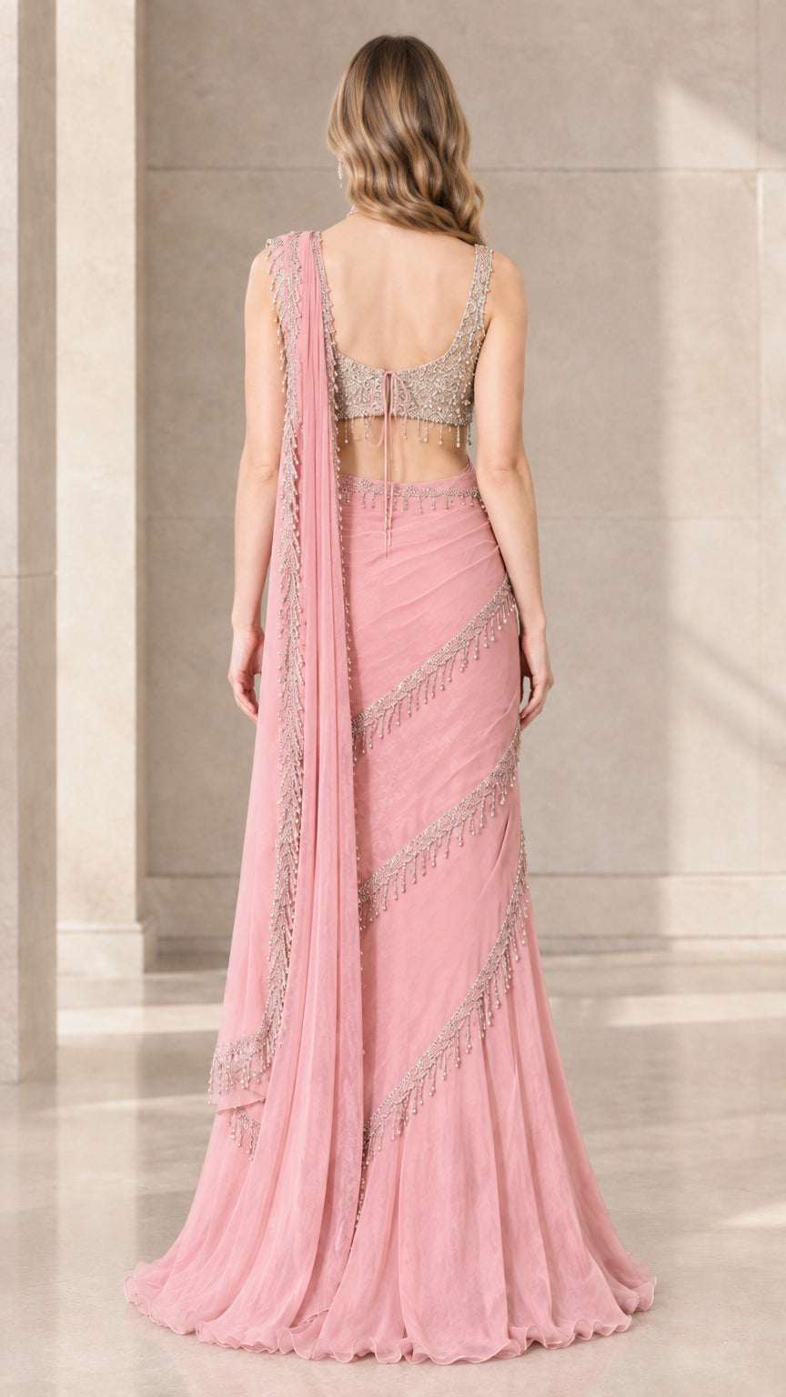 Back view of model wearing Blush Pink ready-to-wear saree with sequin crop top