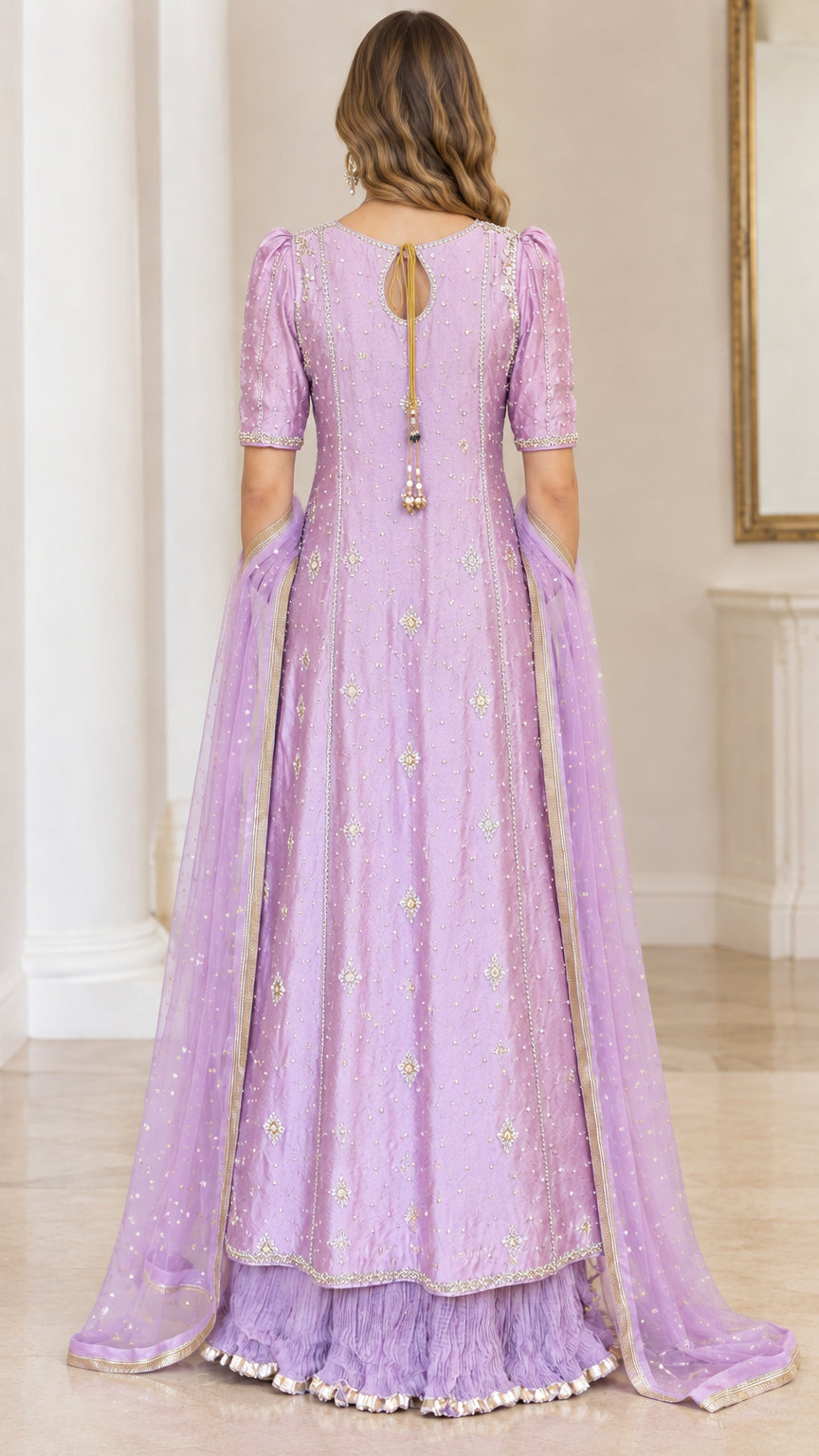 Back view of lavender gown highlighting keyhole back detail and tassel accents