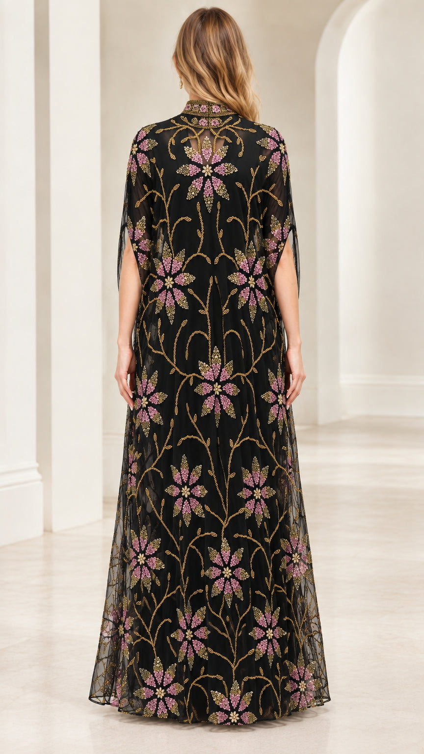 Back view of black beaded maxi dress with elegant cape overlay